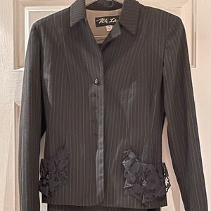 Designer women’s suit. Worn once.